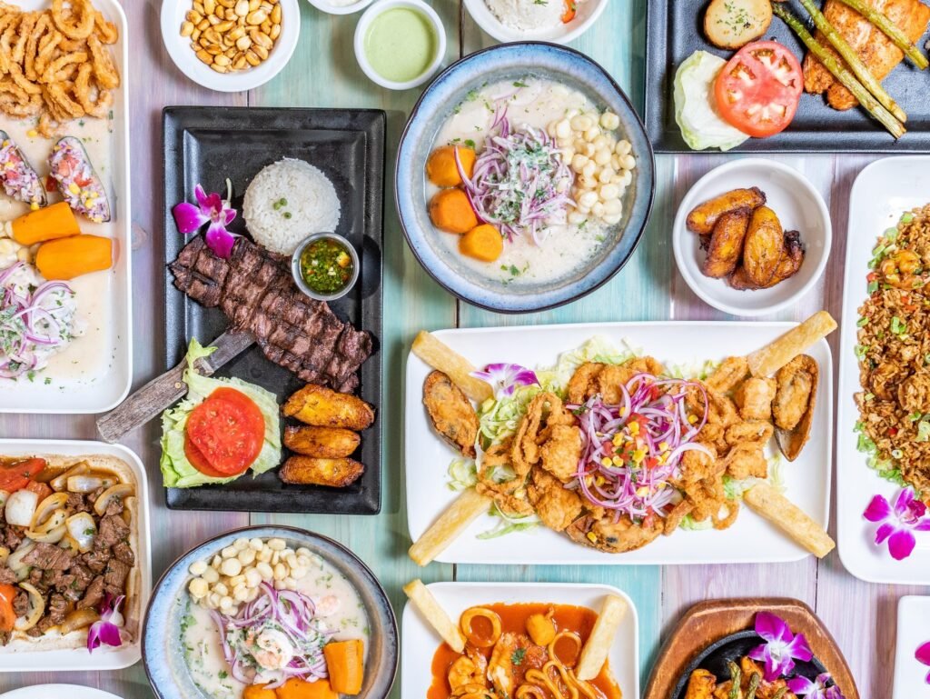 Best ceviche in Daytona Beach with authentic Peruvian food spread including lomo saltado, anticuchos, pollo a la brasa, and fried yuca
